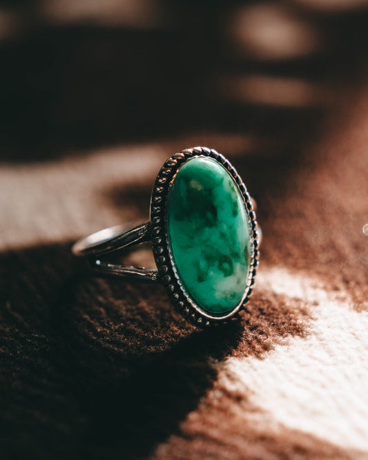 Turquoise oval western-style jewelry- This gorgeous cowgirl-style ring has a turquoise colored gem-stone.