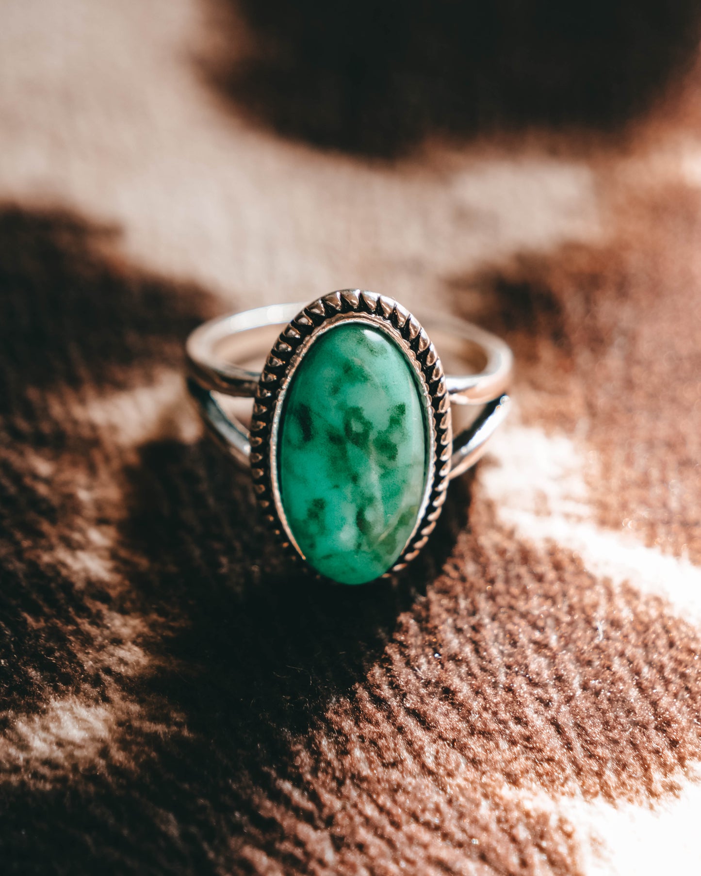 Turquoise oval western-style jewelry- This gorgeous cowgirl-style ring has a turquoise colored gem-stone.