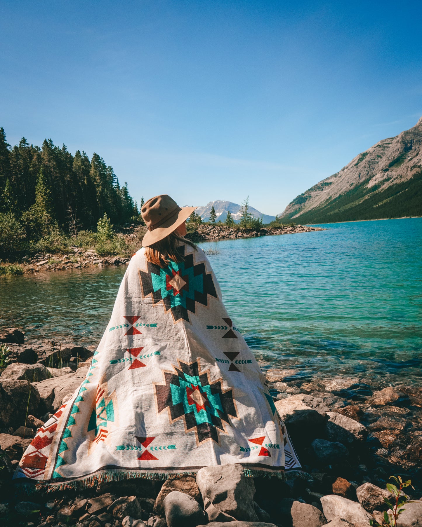 Aztec geometric western style throw rug- The perfect blanket for those cozy cold nights under the stars next to the campfire! Suited for every occasion from picnics, rodeos, camping, van life, yoga, and even beach trips! Or simply place it on your couch or bed for a splash of color to the room!  Color: White and earthy colors 