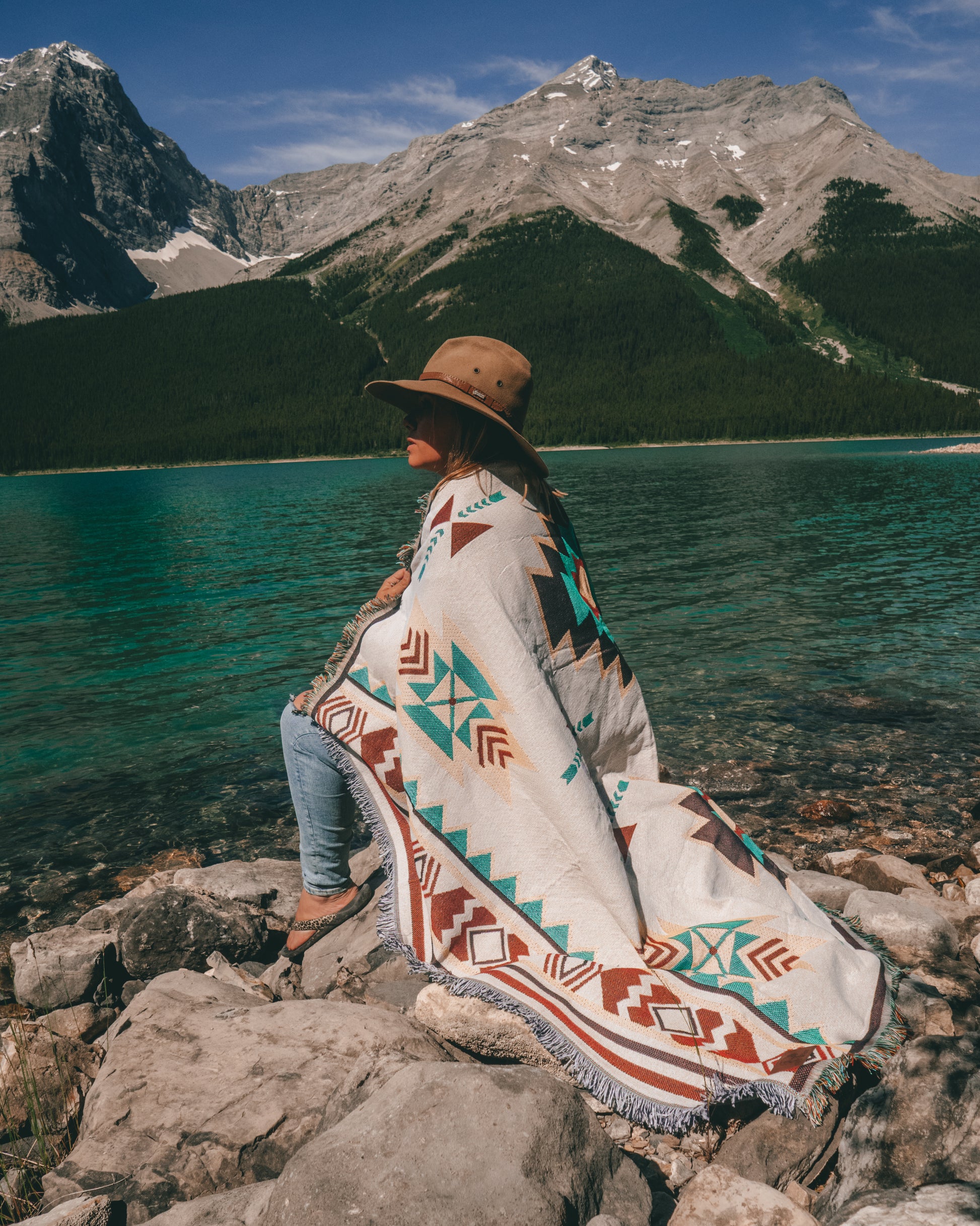 Aztec geometric western style throw rug- The perfect blanket for those cozy cold nights under the stars next to the campfire! Suited for every occasion from picnics, rodeos, camping, van life, yoga, and even beach trips! Or simply place it on your couch or bed for a splash of color to the room!  Color: White and earthy colors 