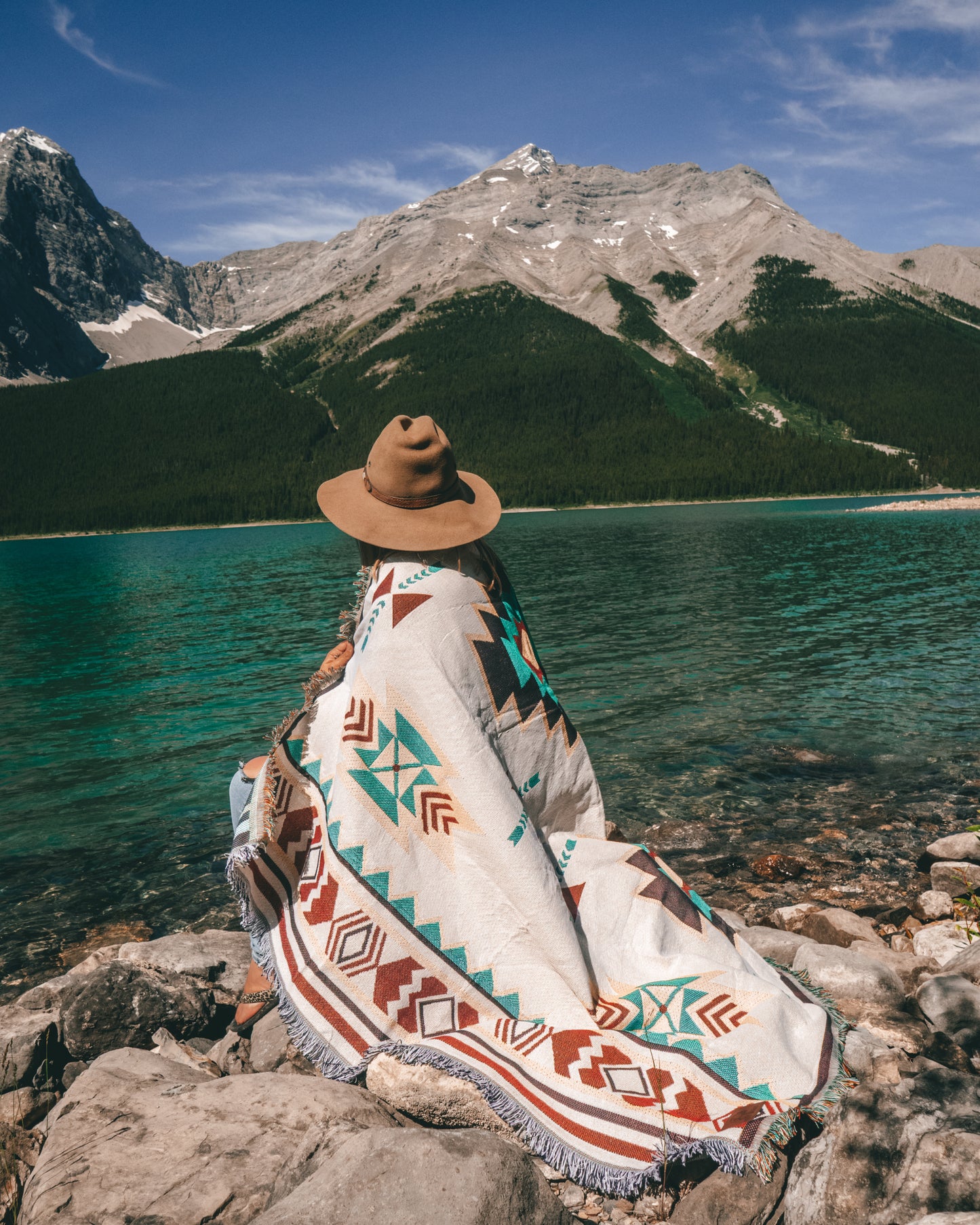 Aztec geometric western style throw rug- The perfect blanket for those cozy cold nights under the stars next to the campfire! Suited for every occasion from picnics, rodeos, camping, van life, yoga, and even beach trips! Or simply place it on your couch or bed for a splash of color to the room!  Color: White and earthy colors 