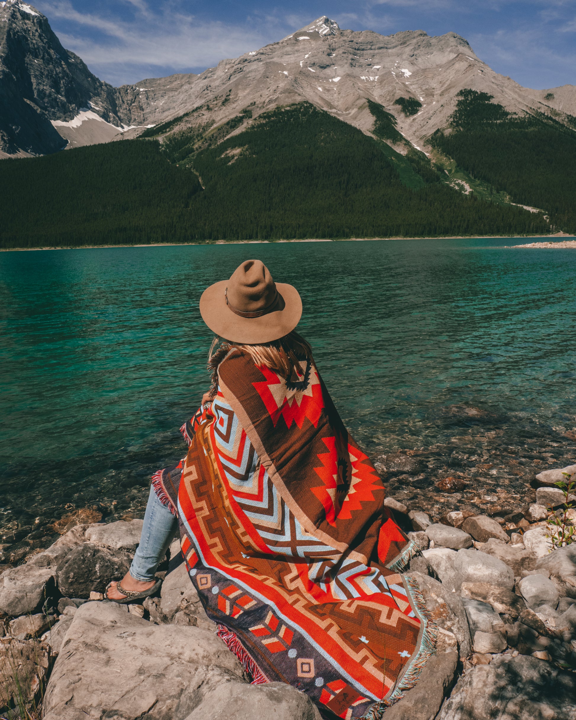 Aztec geometric western style throw rug- The perfect blanket for those cozy cold nights under the stars next to the campfire! Suited for every occasion from picnics, rodeos, camping, van life, yoga, and even beach trips! Or simply place it on your couch or bed for a splash of color to the room!  Color: Earthy brown and reds